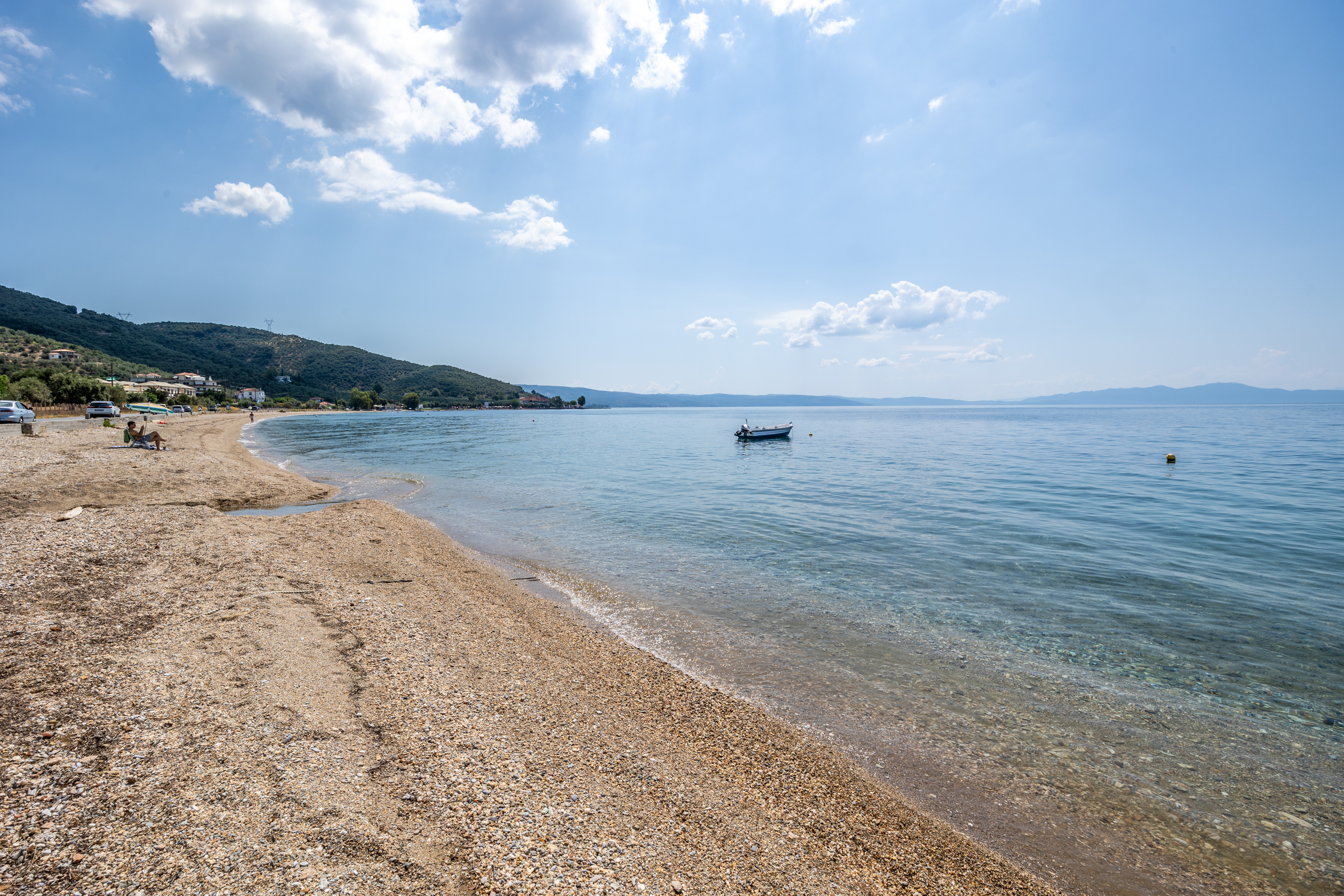 The Pelion shoreline and calm blue sea beside Poseidon
